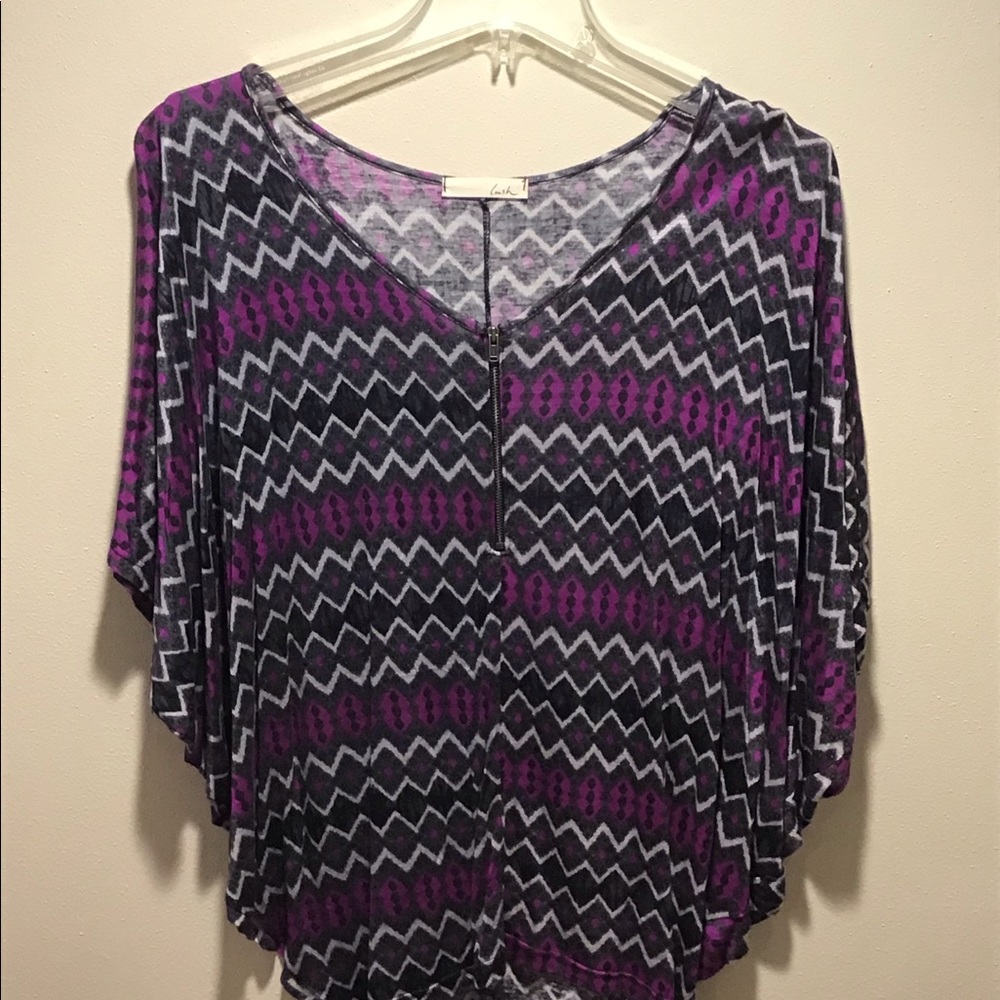 Purple pattern short sleeve top with zipper detail in the front. Size smal